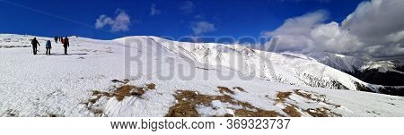 Iezer Mountains, Romania -  February 28, 2020: Hiking In The Mountains  During Winter