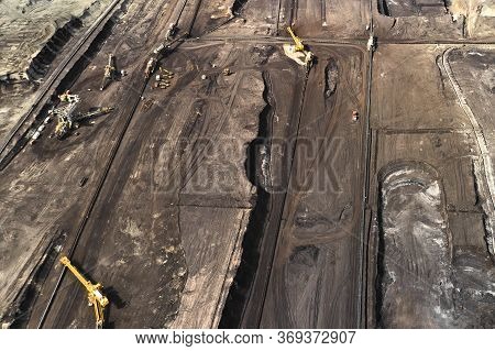Aerial Shoot Of Quarry With Heavy Bucket Wheel Excavators Mining A Coal. Heavy Industry Concept.