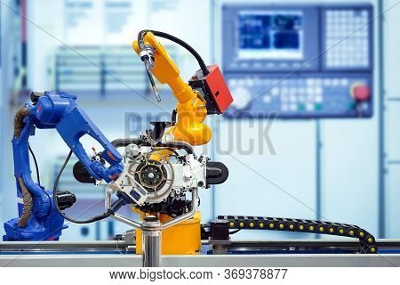 Industrial Robotic Welding And Robotic 3d Scan Working With Engine Parts On Smart Factory, On Blurre