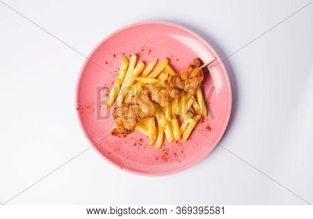 Grilled Meat With French Fries And Vegetable Salad