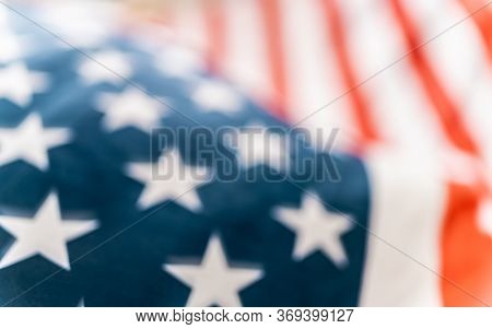 Patriotic holiday. The USA are celebrating 4th of July. American flag close up.