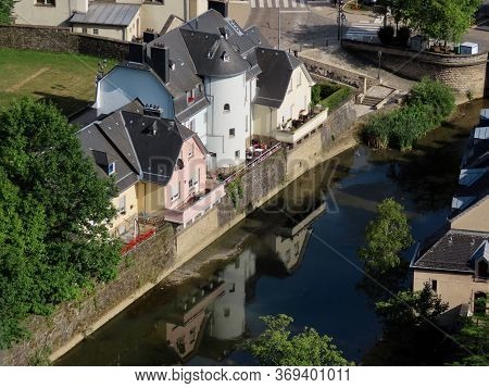 Luxembourg, Luxembourg - July 10, 2019. Old Medieval Buildings Reflecting In Waters Of Alzette River