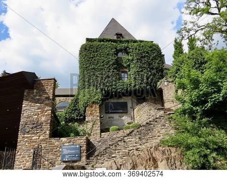 Clervaux, Luxembourg, May 21, 2020. Entrance To Clervaux Castle And Restaurant In Luxembourg, Mediev