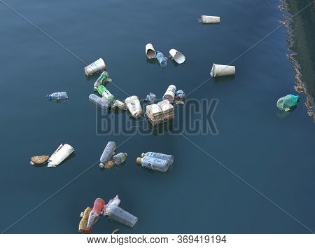 Kaohsiung, Taiwan -- June 2, 2019: Plastic Bottles And Polystyrene Cups Pollute Kaohsiung Harbor