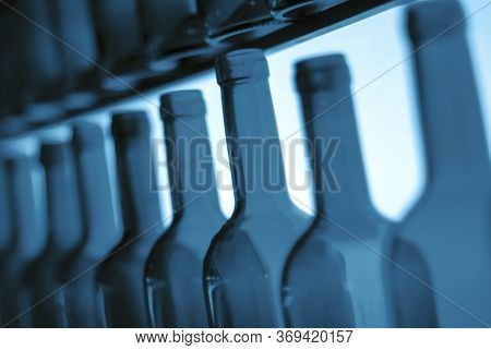 Empty Wine Bottle Necks In A Row As Illustration Of Binge Or Problem Drinking And Depression Caused 