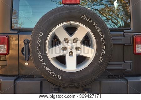 Reykjavik, Iceland - Circa 2018: Spare wheel on the back of a Jeep Wrangler 4x4 off-road vehicle, Goodyear tyre