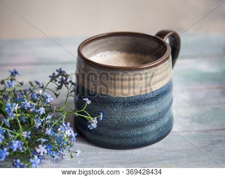 A Large Ceramic Coffee Mug With Creams On A Wooden Tray For A Peppy Morning With A Cool Plan