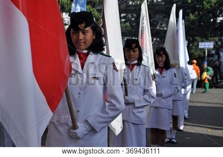 Bogor, Indonesia - June 02, 2012: Indonesian Female Flag Raisers During The Ceremony