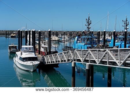 Mackay, Queensland, Australia - June 2020: Luxury Boats And A Tug Boat Moored At The Marina