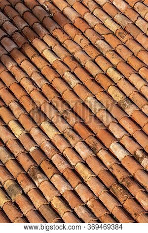 Pantiles. Closeup Of An Old House Roof With Tiles Made From Clay (coppo In Italian Language), Seen F