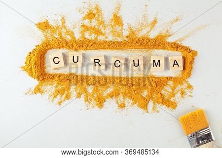 Text Curcuma And Turmeric Powder On Gray Background