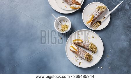 Traditional Italian Dessert Cannoli Siciliani On The Dark Background, Top View Image With A Copy Spa