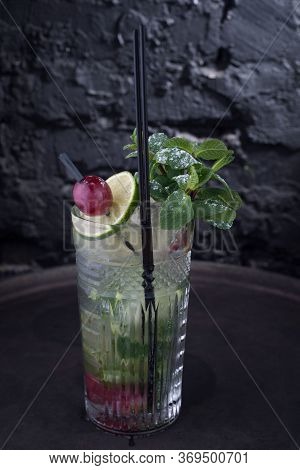Close-up, Advertising Shot Of A Light Alcoholic Cocktail, With A Sprig Of Mint, Icing Sugar, With De