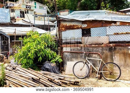 Bicycle Near Old Rusty Houses In Fishing Village Tai O, Lantau, Hong Kong, Sar Of China.
