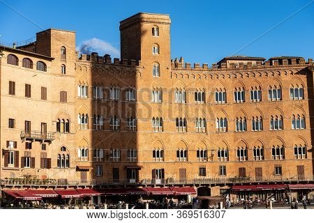 Siena, Tuscany, Italy - Jan 6, 2017: Ancient Medieval Palaces (palazzo Sansedoni) In Piazza Del Camp