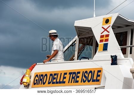 Porto Venere, Italy, July 28, 2014: Captain On The Ferry Boat In Portovenere, Liguria, Italy. Tour O