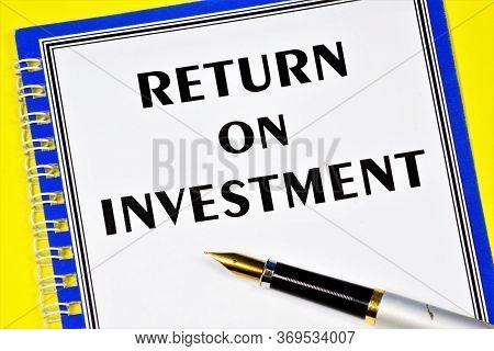 Return On Investment-text Label In The Document On The Folder. The Financial Coefficient Shows The L