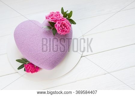 Modern  Mousse Cake .heart Shape  Cake Covered With Purple Chocolate Velour And Decoraited Of Pink R