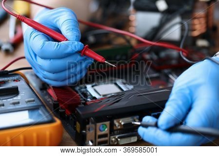 Gloved Hands, On Table Repair An Electronic Device. Diagnosis Device Malfunction. Manual Assembly An