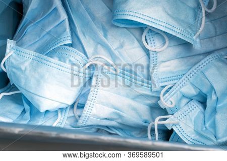 Quarantine Time Finishing. Face Masks In Blue Trash Bag. Recycling Waste. Lots Of Facemasks After Co