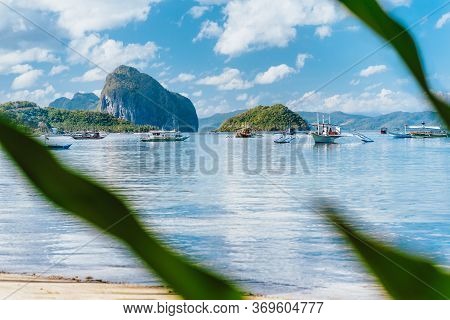 Beautiful Tropical Landscape. El-nido, Philippines. Banca Boats Resting On Tranquil Early Morning At