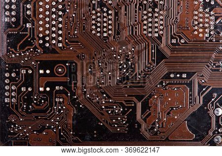 Modern printed brown circuit board, electronic circuit board, textolite. Background banner.