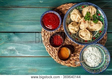 Traditional Uzbek Manti On A Blue Ceramic Dish With White Floral Ornament In Central Asian Style. Or