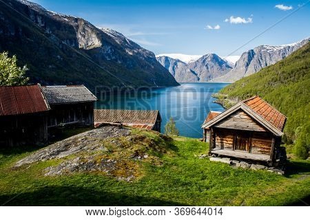 Otternes, Norway, May 2014: View On The Old Historical Village With Wooden Houses And Aurlandsfjord 
