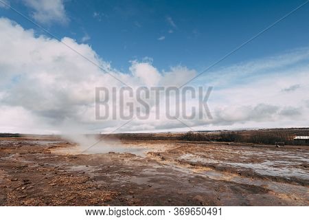 Geyser Valley In The Southwest Of Iceland. The Famous Tourist Attraction Geysir. Geothermal Zone Hau