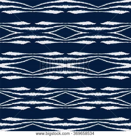 Cold Ikat Ogee Vector Seamless Pattern. Navajo Fabric Batik Background. Geometric African Wallpaper.