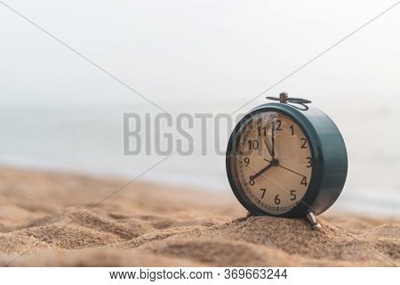 Selective Focus Of Alarm Clock On Side Table Beside Bed Show 8 O\'clock In The Morning Background.ti