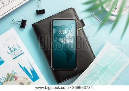 Business' New Normal After Corona Virus Covid19 Pandemic Background Concept.  Smartphone With  Notbo