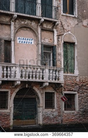 Facade Of The Old Building Of The Caneva Hotel In Venice, Italy.