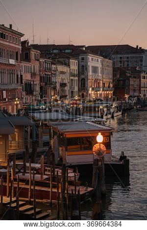 The Buildings On The Grand Canal Of Venice, Italy,  Embankment Lit Lights. It Got Dark.