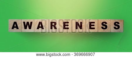 Awareness Alphabet Letter On Wooden Cubes On Green Background. Saving Nature Eological Concept, Heal