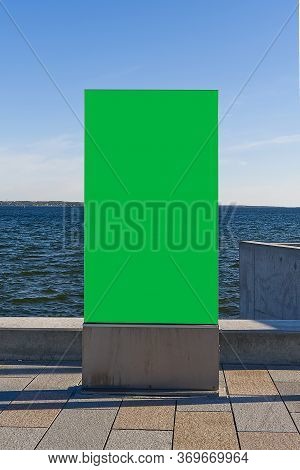 Chroma Key Poster On A Background Of Baltic Sea. Suitable For Advertising. Blank Billboard And Outdo