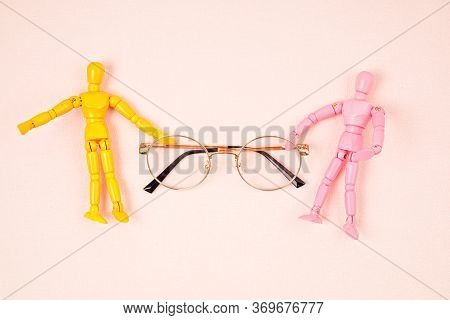 Flat Lay With To Maniquins Holding Eye Glasses. Eye Vision Check Concept. Top View