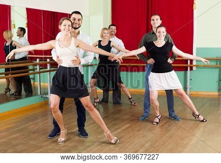 Happy Spanish Group Of People Have Fun While Dancing Waltz