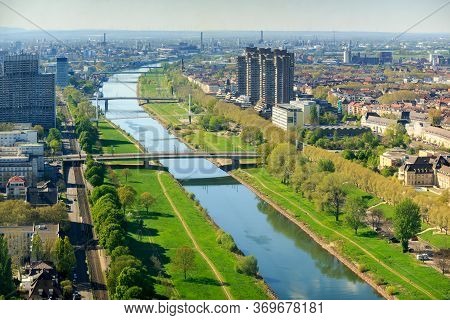 Mannheim. Germany. - April 19, 2019: Top View Of The Embankment Of The Neckar River. Bridges, Green 