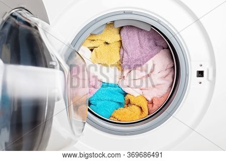 Washing Or Drying Machine Loaded With The Laundry. Washing, Spring Cleaning Concept