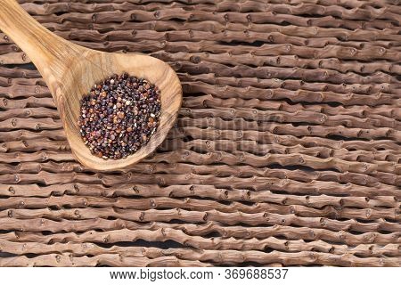 Black Quinoa Seeds - Chenopodium Petiolare. Wood Background