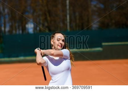 Happy Beautiful Sexy Girl Playing Tennis On The Court. Sport And Recreation, Leisure