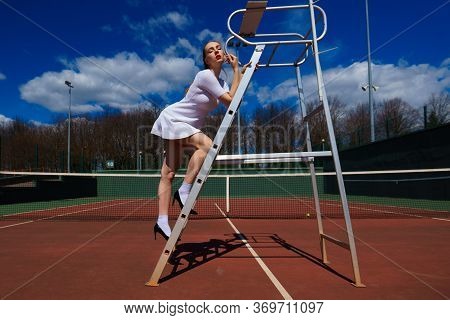 Happy Beautiful Sexy Girl Playing Tennis On The Court. Sport And Recreation, Leisure