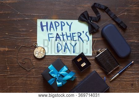 Happy Fathers Day Card And Stylish Mens Accessories On Wooden Background, Top View
