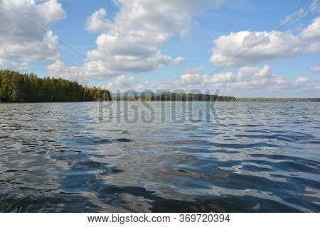 blue clear lake and sky with clouds