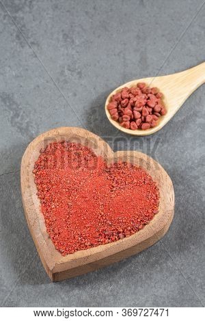 Annatto Seeds And Powder. Top View - Bixa Orellana