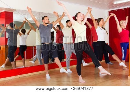 Males And Females Smiling And Dancing Contemp Dance In Studio