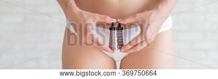 Unrecognizable Woman In White Panties Holds In Hands A Mini Grater. Metaphor Of The Bristles After D