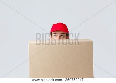 Packages And Parcels Delivery, Covid-19 Quarantine And Transfer Orders. Cute Courier In Red Uniform 