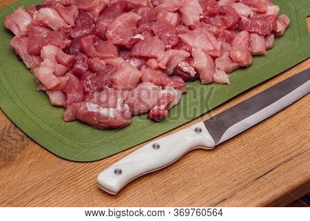 Sliced Raw Meat Background. Cooking Pork Meat. Sliced Meat On A Cutting Board. Ingredient For Cookin